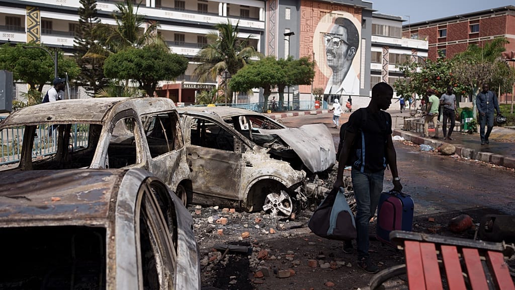 Senegal Campus Crisis: Student Protests Turn Violent as Bursary Delays and Canteen Closures Spark Clashes with Police.